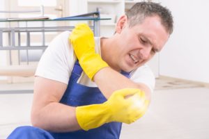 An injured worker examines his elbow.