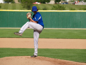 action shot of a high school baseball pitcher on the pitcher's mound